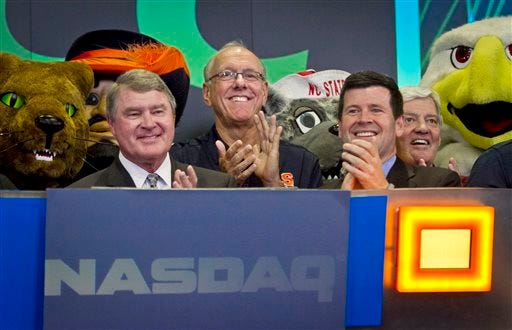 Atlantic Coast Conference commissioner John Swofford, far left, Syracuse basketball coach Jim Boeheim, second from left, NASDAQ head of listings Bob McCooey, second from right, and Virginia Tech football coach Frank Beamer, far right, reacts during the ringing of the closing bell on Monday, July 1, 2013 in New York. The ACC visited the NASDAQ Market Site in Times Square to officially announce the addition of its three new members in Notre Dame, Pitt and Syracuse.