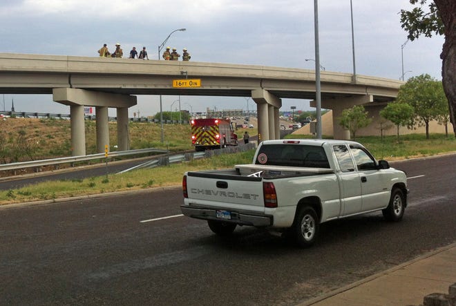 Emergency responders secure the scene of a bizarre wreck involving the Interstate 40 on and off ramps at Georgia Street.
