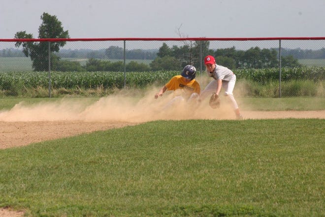 With the ball still in the air, Jeffrey Hedges slides safely into second base in the first inning in Canton’s game in the Central Illinois Prep League Tournament on Tuesday. The Little Giants went on the score four runs in their first at bat in what turned into a lopsided 16-0 win.