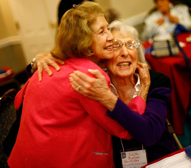 From left, Jean Demers Cyr of Scituate and Edith Burton Griffiths of Marshfield hug after not seeing each other for a long time. Both joined the Cadet Nurse Corps in 1943.