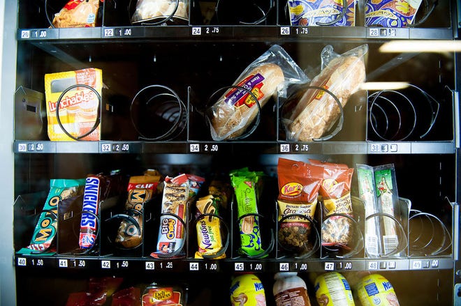 Candy bars, chips and soda offered in a vending machine at Rock Bridge High School will be replaced with healthier options next year because of new government rules.