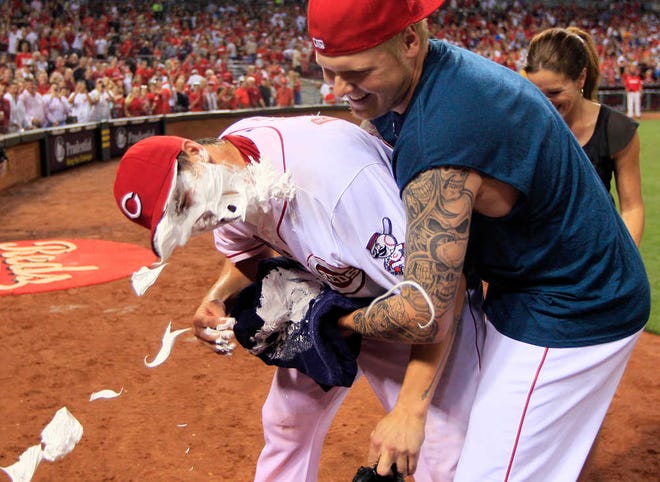 Cincinnati Reds starting pitcher Homer Bailey, left, gets a face full of shaving cream from Mat Latos after Bailey threw a no-hitter against the San Francisco Giants on Tuesday.