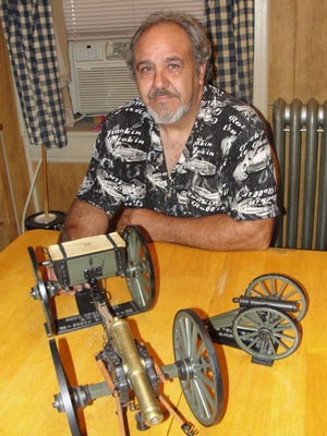 George W. Funt Jr. of Waynesboro is shown with two of his Civil War era cannon models.