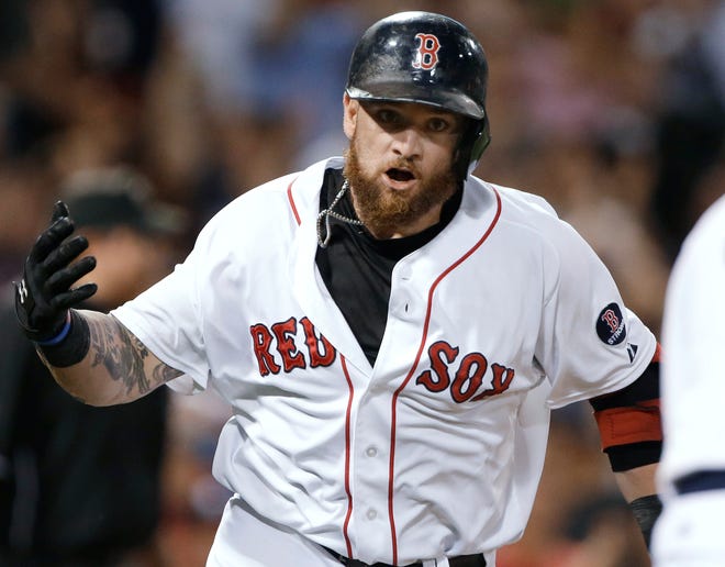 Jonny Gomes celebrates his walkoff home run as he runs to first base Wednesday night.