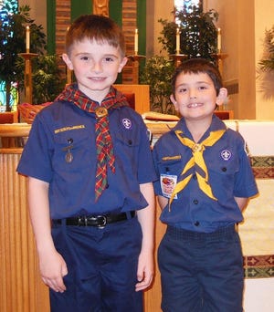 John Melchiori (left) and Jacob Muth (right) received the Light Of Christ Emblem on June 2, 2013 from Reverend Thomas D. McLaughlin at Saint Luke's Catholic Church in Stroudsburg. They are members of cub scout pack 84.