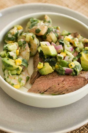 Pepper-lime flank steak with shrimp and salmon ceviche is a new way to enjoy surf and turf. (AP Photo/Matthew Mead)