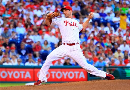 Philadelphia Phillies' Cliff Lee delivers during the first inning of a baseball game with the Atlanta Braves, Friday, July 5, 2013, in Philadelphia. (AP Photo/Tom Mihalek)