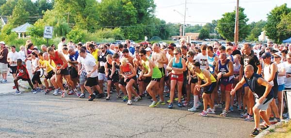 Submitted photo - Runners take off at the starting line for last year’s “Lawyer’s for Kids” race in Morris Township. The race benefits CASA of Morris and Sussex Counties.
