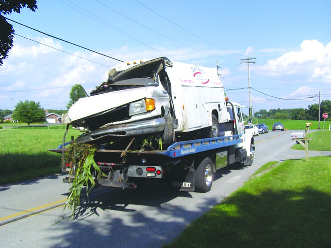 A tow truck removed the van that was involved in a collision with a train on Mason Road in Antrim Township Monday afternoon.