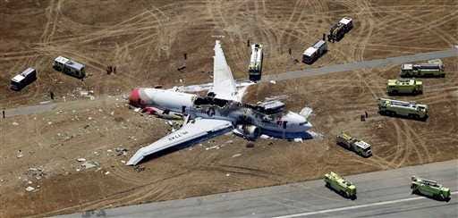 In this Saturday, July 6, 2013 aerial photo, the wreckage of Asiana Flight 214 lies on the ground after it crashed at the San Francisco International Airport, in San Francisco. The pilot at the controls of airliner had just 43 hours of flight time in the Boeing 777 and was landing one for the first time at San Francisco International. (AP Photo/Marcio Jose Sanchez)