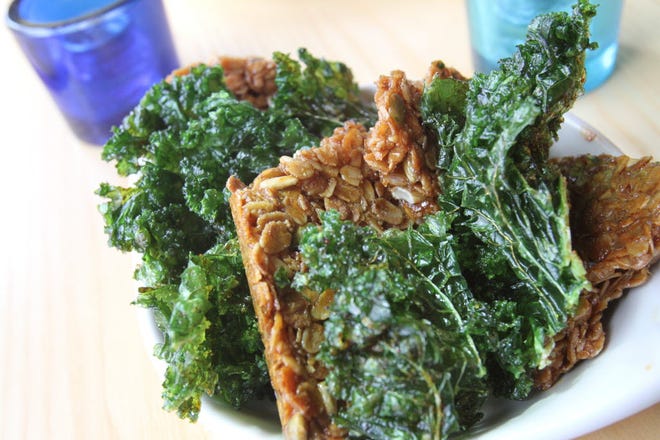 One of the best ways I know to enjoy kale comes from chef Matt Louis at Moxy restaurant in Portsmouth, N.H. His Chili-Scented Crispy Kale is paired with pumpkin-sunflower seed granola bites.
