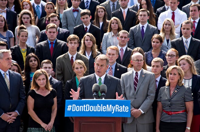 In this July 8, 2013, photo, with a backdrop of college students on the step of the House of Representatives, Speaker of the House John Boehner, R-Ohio, center, and GOP leaders talk about the politics of federal student loan rates which doubled on July 1, at the Capitol in Washington. Senate Democrats are trying to restore lower interest rates on student loans. A procedural vote is scheduled for Wednesday on a Senate measure that would return rates on subsidized Stafford loans to 3.4 percent for one year. An earlier attempt in the Senate to keep rates low came up short and those loans? rates doubled to 6.8 percent on July 1. (AP Photo/J. Scott Applewhite)