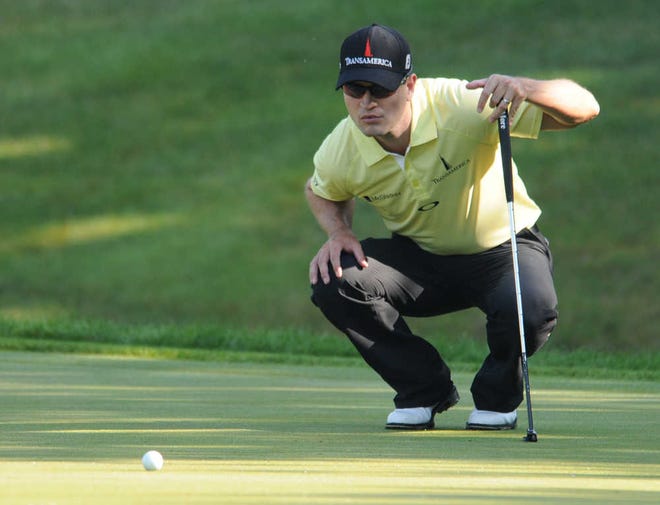 Zach Johnson lines up a putt on the 15th hole during the John Deere Classic golf tournament's pro-am in Silvis, Ill., Thursday, July 11, 2013. (AP Photo/The Dispatch, Gary Krambeck) QUAD CITY TIMES OUT