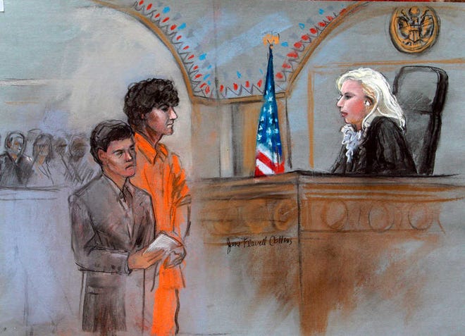 This courtroom sketch depicts Boston Marathon bombing suspect Dzhokhar Tsarnaev standing with his lawyer, Judy Clarke, left, before Magistrate Judge Marianne Bowler during his arraignment in federal court Wednesday in Boston. The 19-year-old has been charged with using a weapon of mass destruction and could face the death penalty.