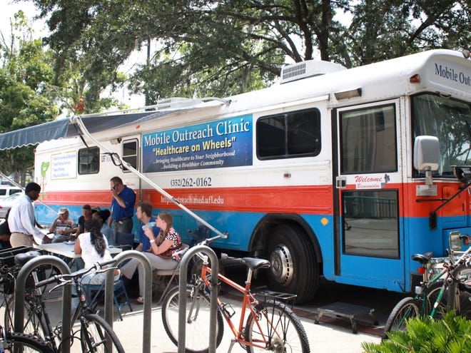 The mobile outreach clinic is parked at the Downtown library on Wednesday, July 3, 2013, in Gainesville, Fla.