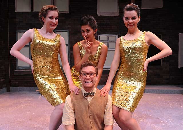 Preston Pounds, seated center, plays floral-shop employee Seymour, surrounded by a chorus of, from left, Monica Brown as Crystal; Marina Pires as Chiffon; and Haley Jones as Ronnette, in the Otterbein Summer Theatre production of Little Shop of Horrors.
