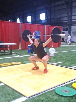 Leanna Holappa warms up at the USA Weightlifting Youth National Championship in St. Joseph, Mo. Holappa, a sophomore at Leesburg High School, finished fifth in her first national competition.