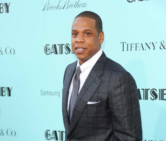 FILE - In this May 1, 2013 file photo, Jay-Z attends "The Great Gatsby" world premiere at Avery Fisher Hall in New York. The rapper released his 12th album, "Magna Carta Holy Grail," three days early on Thursday, July 4, 2013, through a deal with Samsung. The album is officially out Sunday and features Justin Timberlake, Beyonce, Frank Ocean and Timbaland. (Photo by Evan Agostini/Invision/AP, File)