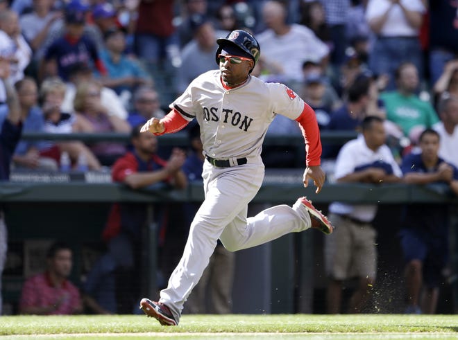 Boston Red Sox's Jackie Bradley Jr. comes around to score against the Seattle Mariners in the 10th inning of a baseball game on Thursday, July 11, 2013, in Seattle. The Red Sox won in 10 innings 8-7. (AP Photo/Elaine Thompson)