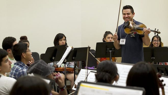 Instructor Martin Padilla leads a violin class Friday at the Longhorn Summer Mariachi Camp at the University of Texas.