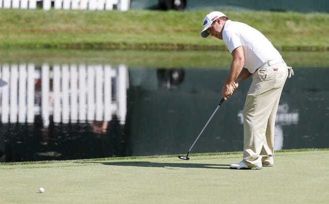 Daniel Summerhays watches his putt on the 18th green during the third round of the John Deere Classic golf tournament at TPC Deere Run, Saturday, July 13, 2013, in Silvis, Ill. (AP Photo/Charlie Neibergall)