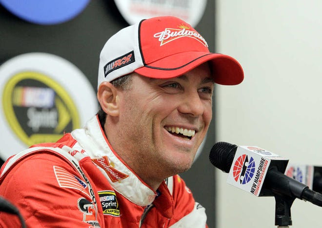 NASCAR driver Kevin Harvick smiles during a news conference before practice for the NASCAR New Hampshire Sprint Cup Series Camping World RV Sales 301 auto race, Friday, July 12, 2013 in Loudon, N.H. Harvick will take his Budweiser sponsorship with him when he moves to Stewart-Haas Racing next season. (AP Photo/Mary Schwalm)