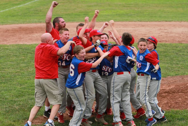 Sprague-Franklin-Canterbury celebrates Friday after winning the District 11 Little League baseball championship in Norwich. SFC defeated Norwich, 4-1, to win the title.