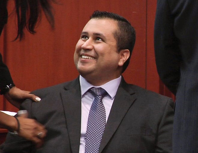 In this image from video, George Zimmerman smiles after a not guilty verdict was handed down in his trial at the Seminole County Courthouse, Sunday, July 14, 2013, in Sanford, Fla. Neighborhood watch captain George Zimmerman was cleared of all charges Saturday in the shooting of Trayvon Martin, the unarmed black teenager whose killing unleashed furious debate across the U.S. over racial profiling, self-defense and equal justice. (AP Photo/TV Pool)