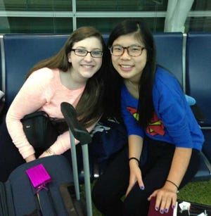 Kelly Regan, left, and Nora Zhang have become fast friends through the student exchange program. Host homes are needed for foreign students attending St. Joseph Academy his coming school year. Contributed photo.