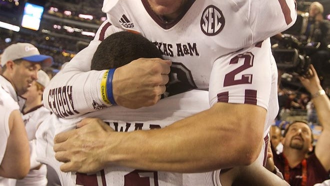 Quarterback Johnny Manziel (2), shown celebrating Texas A&M’s victory over Oklahoma in the Cotton Bowl in January, recently left the prestigious Manning Passing Academy, where he was a coach and counselor, a day early. According to a statement released by organizers of the academy, Manziel was beset by illness.