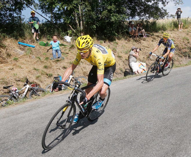 Christopher Froome of Britain, wearing the overall leader's yellow jersey, and Spain's Alberto Contador, right, speed down manse pass in the last kilometers of the sixteenth stage of the Tour de France cycling race over 168 kilometers (105 miles) with start in in Vaison-la-Romaine and finish in Gap, France, Tuesday July 16, 2013. (AP Photo/Laurent Cipriani)