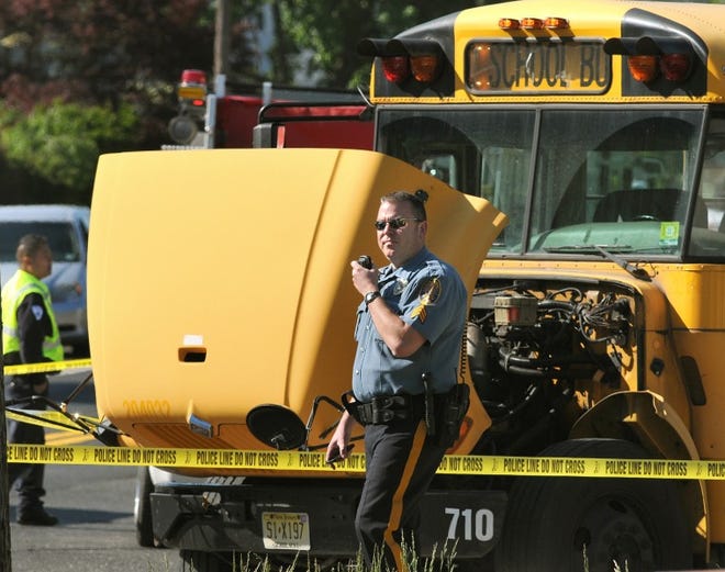 A Burlington County Police Officer at the scene of bus/car accident on Salem Road in Burlington Township on Tuesday morning.