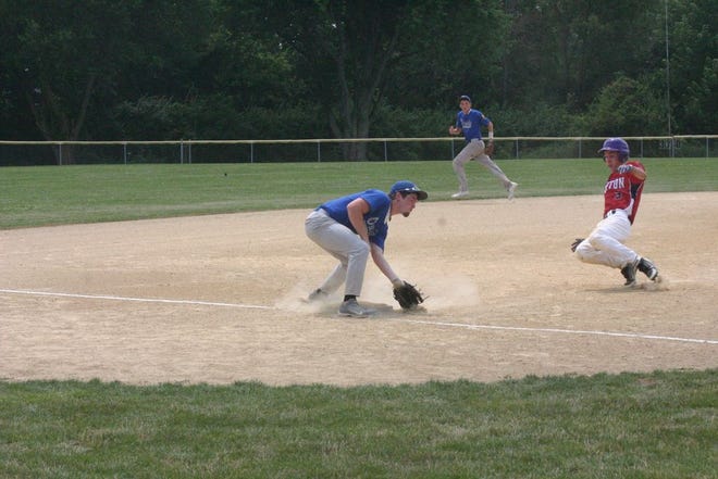 Canton's Cory Barnes begins his slide as he steals third base in Post 16's 15th District Tournament game against Oneida on Tuesday. Barnes scored his team's first run later in the inning, but it wasn't enough as Post 727 ended up winning 9-2.