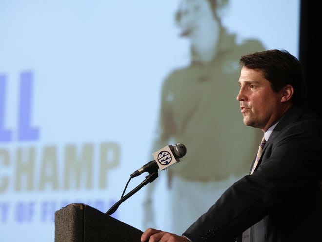 Florida coach Will Muschamp talks with reporters Tuesday during SEC Media Days in Hoover, Ala.