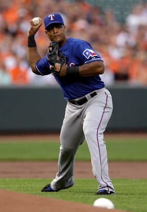 Texas Rangers third baseman Adrian Beltre fields a ground ball during a baseball game against the Baltimore Orioles, Tuesday, July 9, 2013, in Baltimore. (AP Photo/Patrick Semansky)