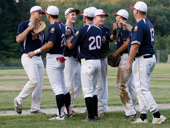 The Ashland Legion baseball team celebrates its 9-5 win over Reading on Tuesday night after catching a runner in a pickle between second and third base for the final out.