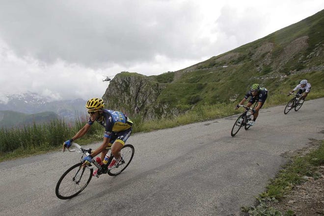 Christophe Ena Associated Press Spain's Alberto Contador (front), Spain's Alejandro Valverde (center) and Nairo Alexander Quintana of Colombia speed down Sarenne pass during the 18th stage of the Tour de France over 107.8 miles with the start in Gap and the finish in Alpe-d'Huez, France, on Thursday.
