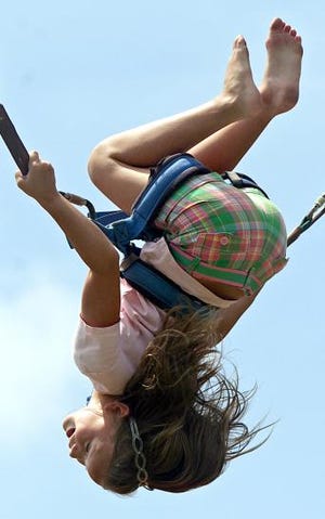 Brittany Walker, 8, flips while bouncing at Kings Mountain’s Beach Blast. (Star file photo)