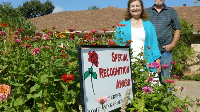 June and Harlan Cooper received recognition for their garden in the Lost Creek neighborhood.