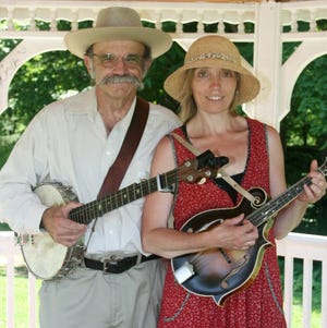 Providing the apres-parade entertainment, traditional style, in Milton Mills on July 4 were Drowned Valley members, Paul Mangion of Berwick, Maine, and Carolyn Hutton of Madbury.