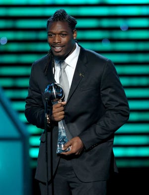 South Carolina's Jadeveon Clowney accepts the award for best play at the ESPY Awards in Los Angeles on Wednesday.