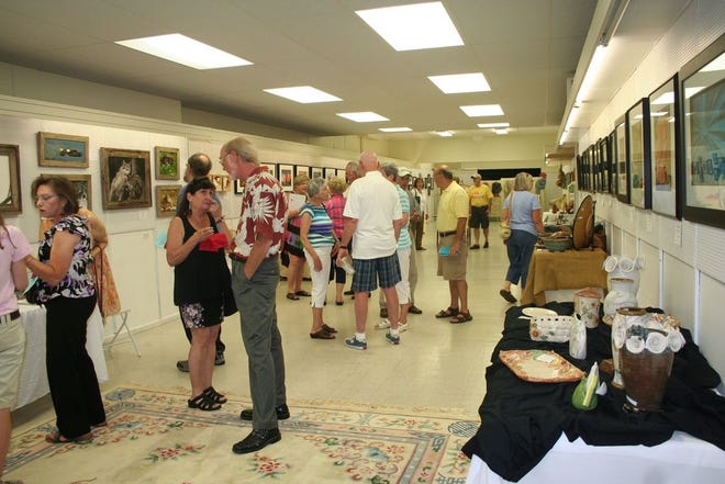Visitors flocked to the kick off of Destination ARTS! Friday evening in Waynesboro to enjoy more than 800 pieces of artwork and music, including this gallery at 22 W. Main St. called, ‘Through the Lens of the Earth,’ which encompasses photography, digital arts, pottery and fiber arts.
