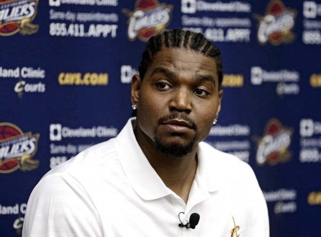 New Cavaliers center Andrew Bynum listens to a question during his introductory press conference in Cleveland on Friday.
