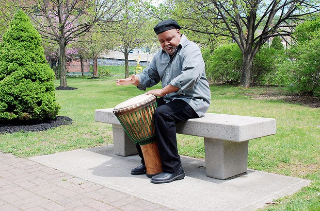 Renowned jazz musician Bill Jacobs is pictured playing the Cuban drum in Sterzinar Park in the city of Little Falls in. Jacobs will teach a one-week music camp for students beginning Monday at the Mohawk Valley Center for the Arts.