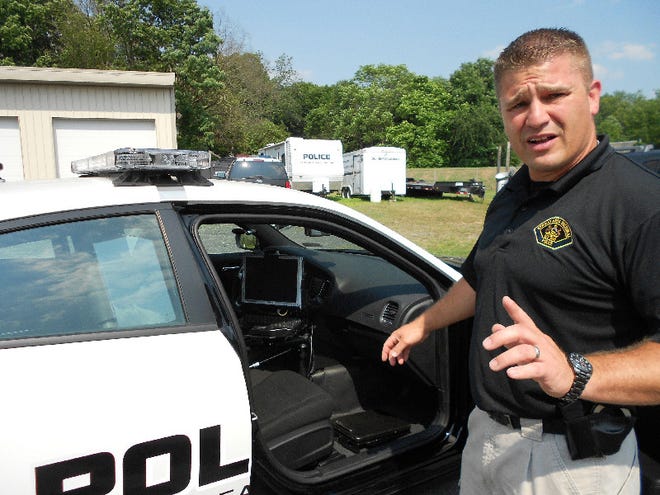 Stroud Area Regional Police Department Officer Kevin Transue talks about one of the department’s vehicles on Friday in East Stroudsburg.