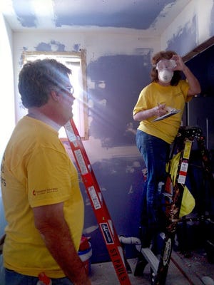 Volunteers from Methodist churches in Burlington County help a Highlands man reconstruct his house which was heavily damaged during Superstorm Sandy