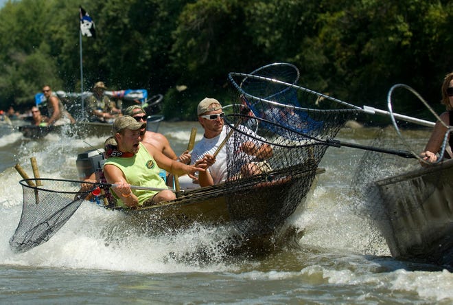 Boats try to avoid a collision as they run at speed as mayhem ensues at the Redneck Fishing Tournament Friday.