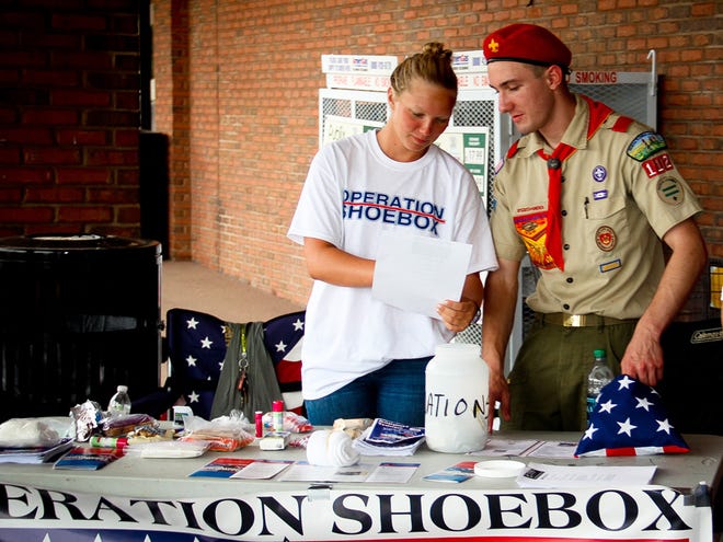 Eagle Scout candidate Michael Tedeschi collects goods for troops overseas in partnership with Operation Shoebox at Publix at Churchill Shopping Center in Ocala on Saturday.