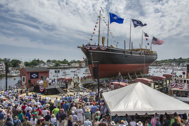 Thousand of people crowded Mystic Seaport, the banks of the Mystic River and the river itself on small watercraft to watch the relaunch of the historic Charles W. Morgan whaler on Sunday.