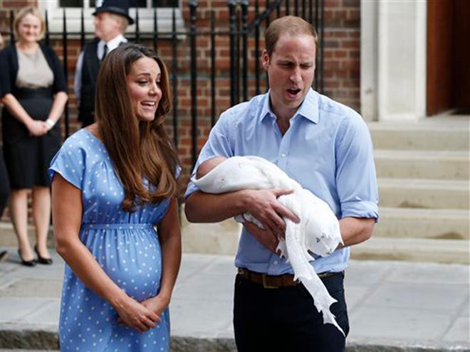 Britain's Prince William and Kate, Duchess of Cambridge hold the Prince of Cambridge, Tuesday July 23, 2013, as they pose for photographers outside St. Mary's Hospital exclusive Lindo Wing in London where the Duchess gave birth on Monday July 22. The Royal couple are expected to head to London’s Kensington Palace from the hospital with their newly born son, the third in line to the British throne. (AP Photo/Lefteris Pitarakis)